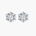 Close-up of round brilliant-cut moissanite stud earrings in 6-prong sterling silver settings showing exceptional sparkle