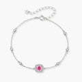 Elegant sterling silver chain bracelet featuring pink moissanite center stone in cushion halo setting with adjustable clasp