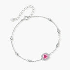 Elegant sterling silver chain bracelet featuring pink moissanite center stone in cushion halo setting with adjustable clasp