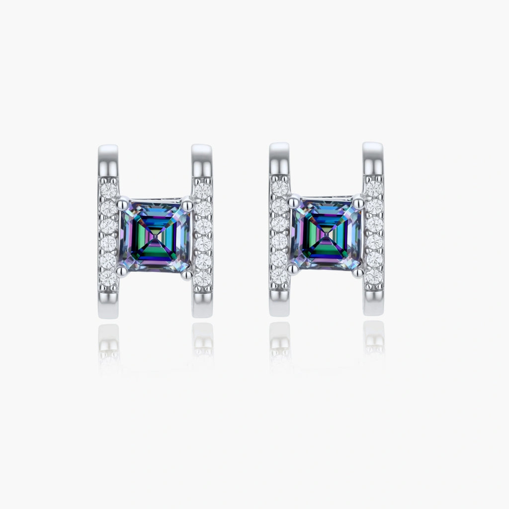 Square moissanite studs in sterling silver geometric setting showing rainbow prismatic fire on white background.