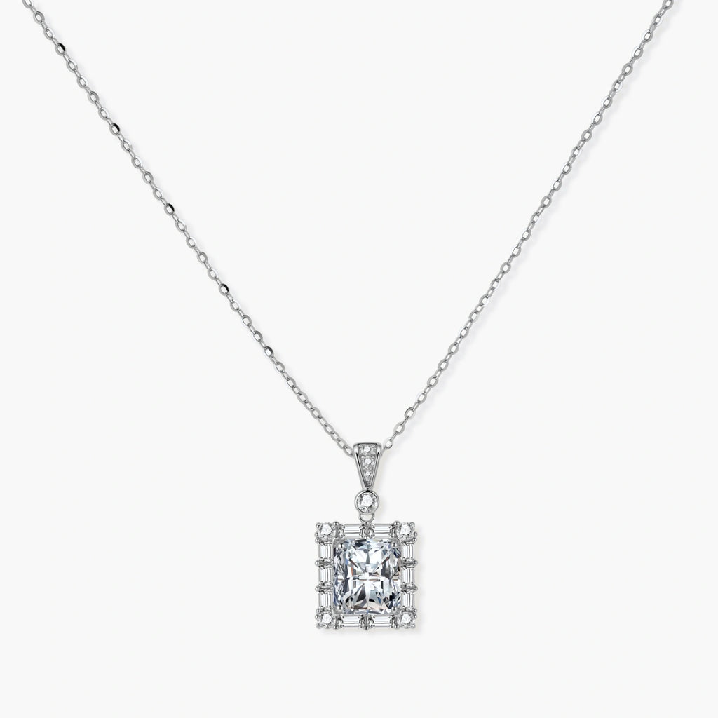 Square moissanite pendant with halo setting on delicate sterling silver chain against white background.