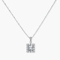 Square moissanite pendant with halo setting on delicate sterling silver chain against white background.