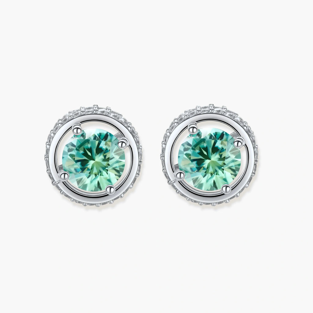 Round green moissanite stud earrings in sterling silver halo settings with brilliant sparkle on white background.