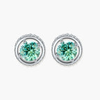 Round green moissanite stud earrings in sterling silver halo settings with brilliant sparkle on white background.
