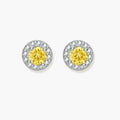 Dainty sterling silver stud earrings with yellow moissanite center stones surrounded by white halo stones