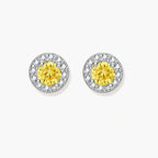 Dainty sterling silver stud earrings with yellow moissanite center stones surrounded by white halo stones