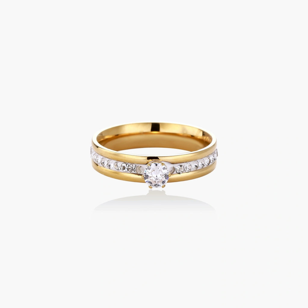Gold-plated double-band ring with center rhinestone solitaire and channel-set stones on white background