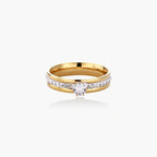 Gold-plated double-band ring with center rhinestone solitaire and channel-set stones on white background