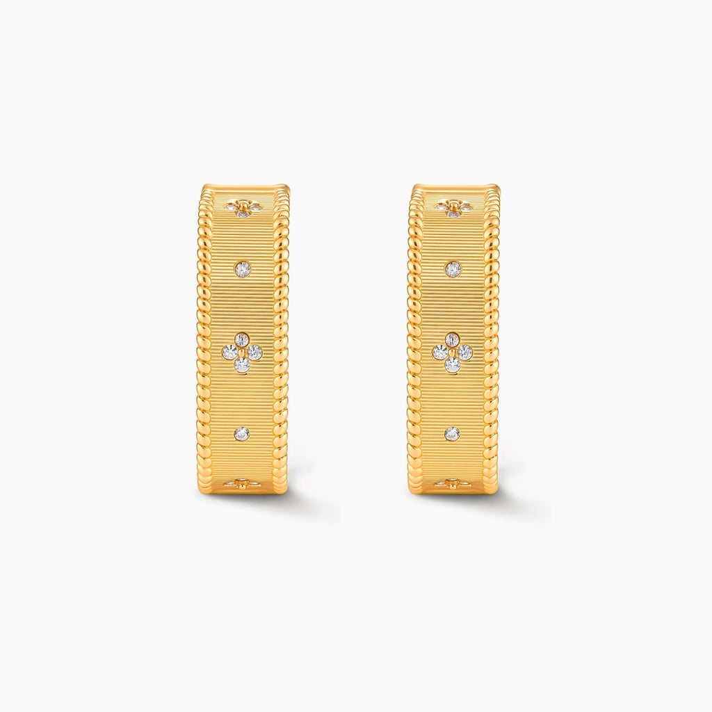 Square huggie hoop earrings in 18K gold-plated silver with ribbed texture, rope borders, floral CZ clusters, and filigree inner lace.
