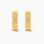 Square huggie hoop earrings in 18K gold-plated silver with ribbed texture, rope borders, floral CZ clusters, and filigree inner lace.