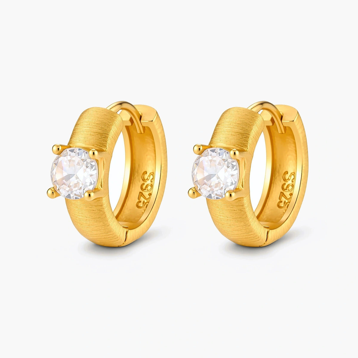 18K gold-plated 925 silver huggie hoops with brushed finish and prong-set round CZ solitaire, stamped S925 inside.