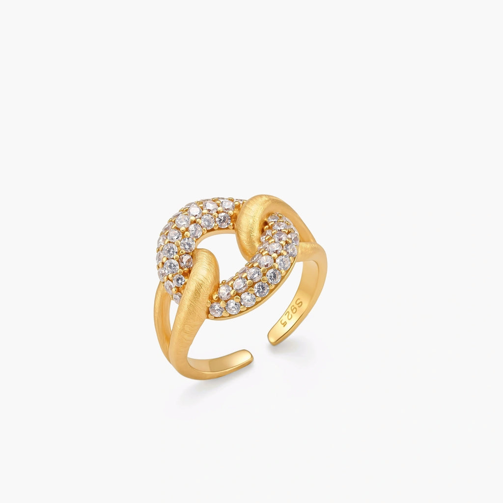 Adjustable 18K gold-plated open cuff ring with interlocking chain links, one brushed gold, one pavé-set cubic zirconia. S925 stamped.