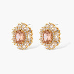 Ornate gold-plated jewelry set featuring peach center stone surrounded by clear AAA cubic zirconia crystals