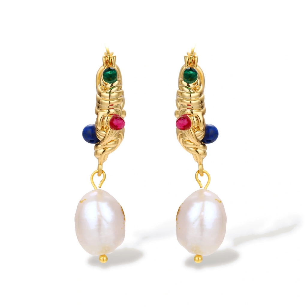 Ornate gold-plated hoop earrings with emerald, ruby, and sapphire accents, featuring dangling baroque freshwater pearls