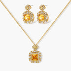 14K gold-plated jewelry set featuring square-cut cubic zirconia stones in ornate layered settings on white background.