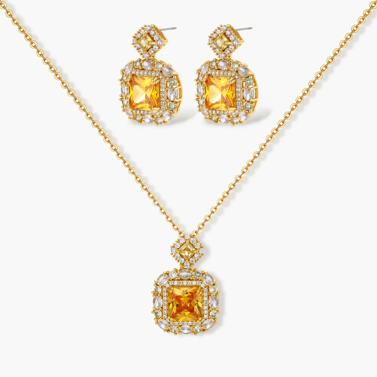 14K gold-plated jewelry set featuring square-cut cubic zirconia stones in ornate layered settings on white background.
