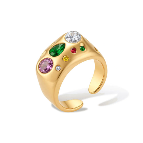 Gold-plated adjustable dome ring with pink, green, white, red, and yellow cubic zirconia stones on cream background.