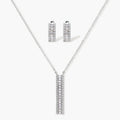 White gold plated necklace with vertical cubic zirconia pendant and matching hoop earrings on neutral background